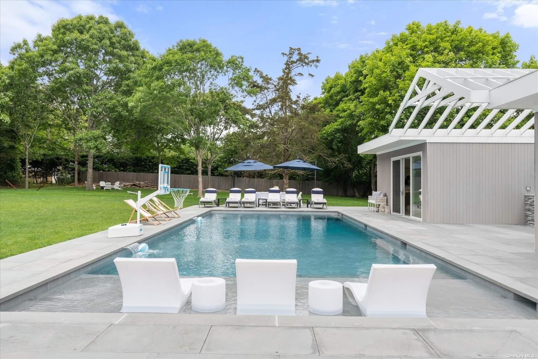 a view of a swimming pool with a lounge chairs