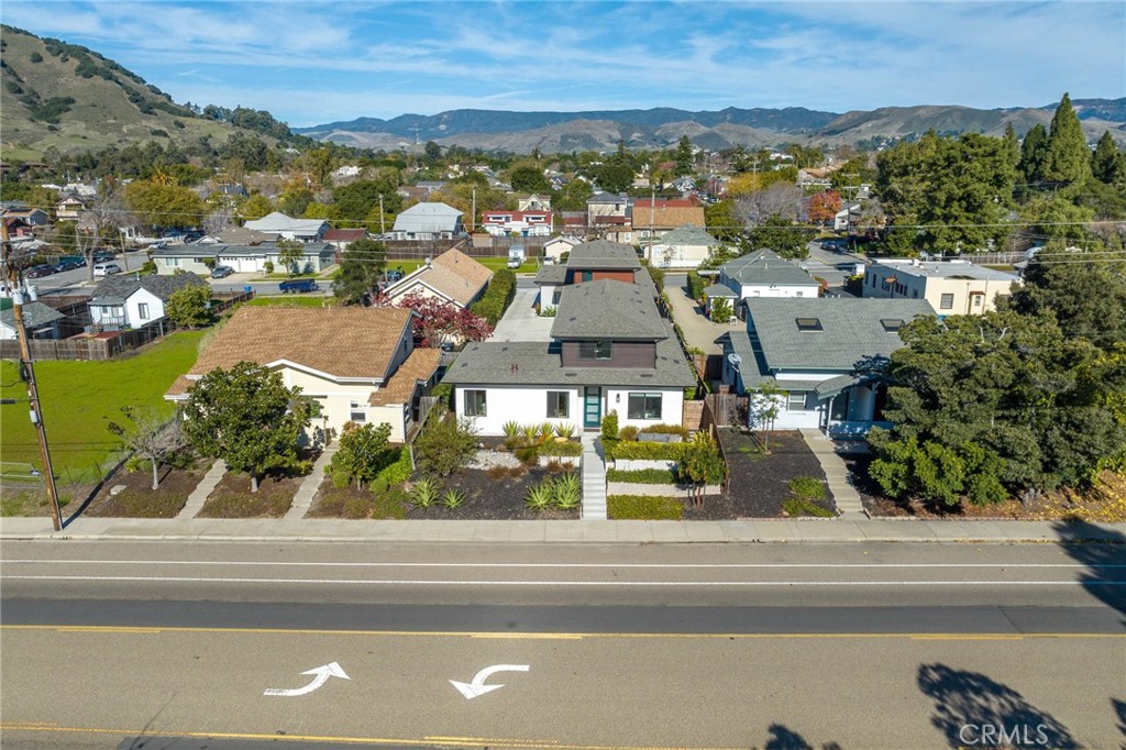 an aerial view of residential houses with outdoor space