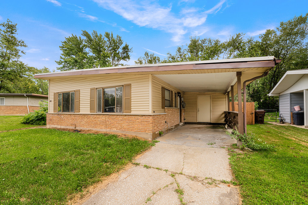 front view of a house with a yard