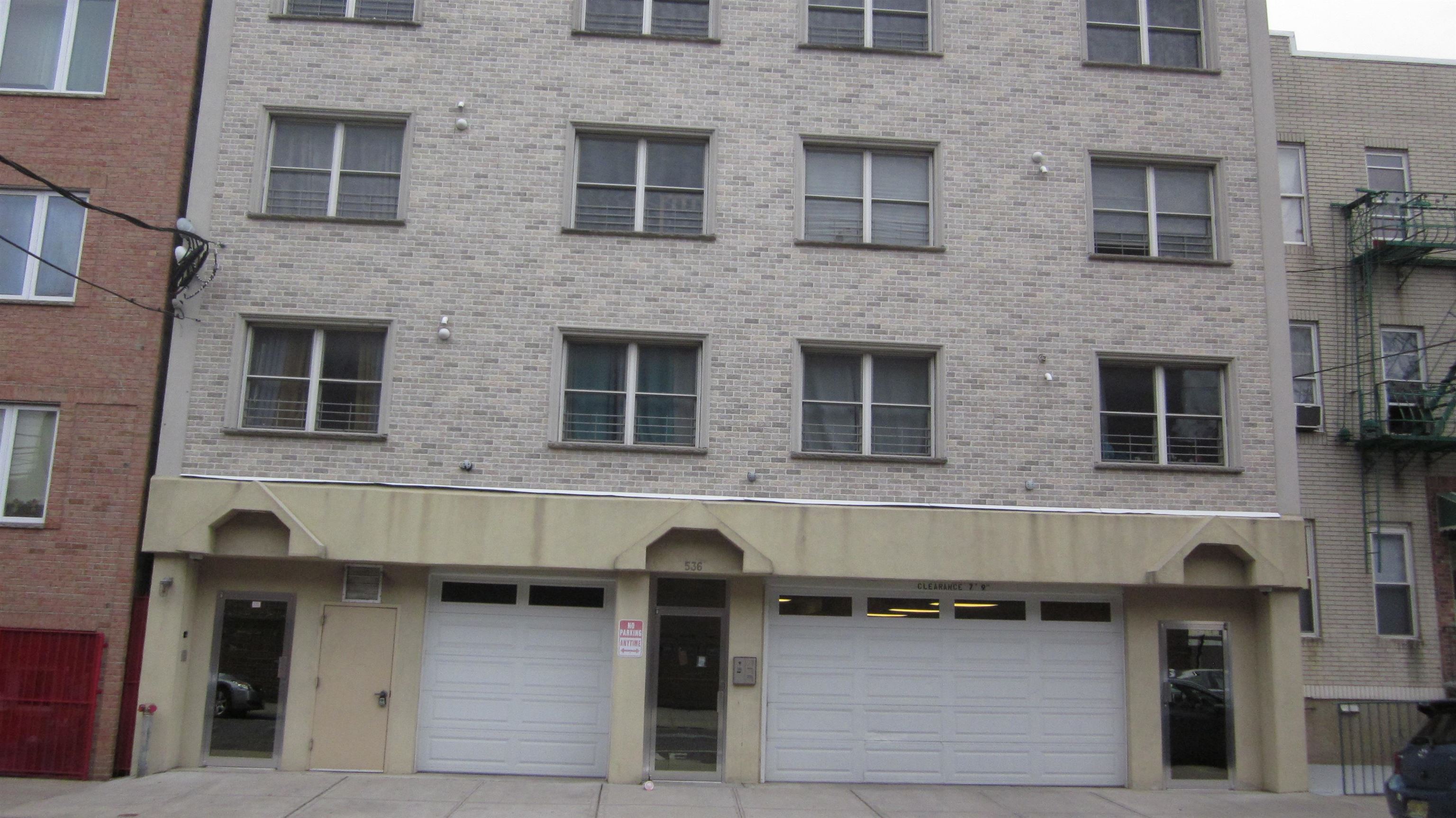 a front view of a building with multiple windows