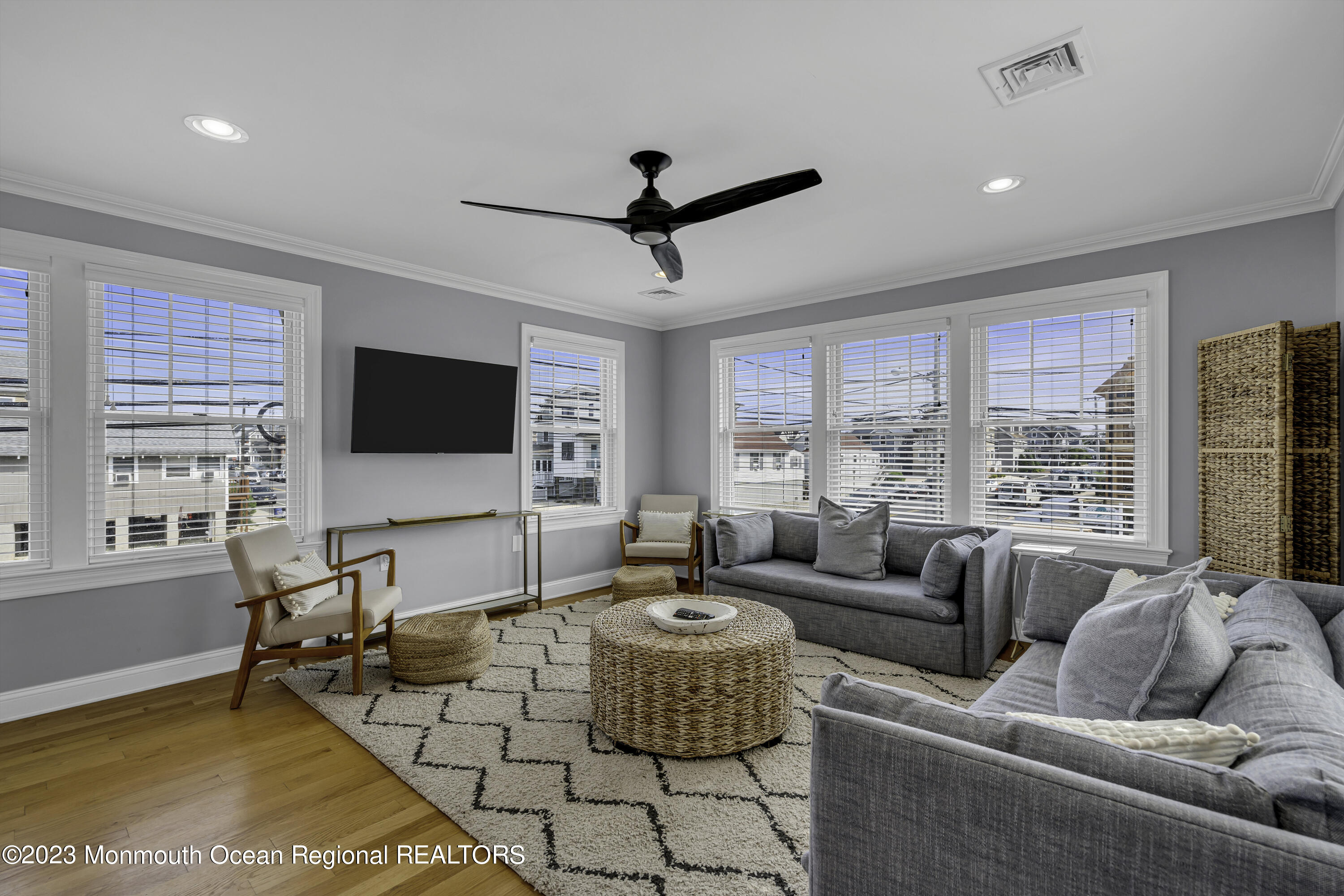 a living room with fireplace furniture and a flat screen tv