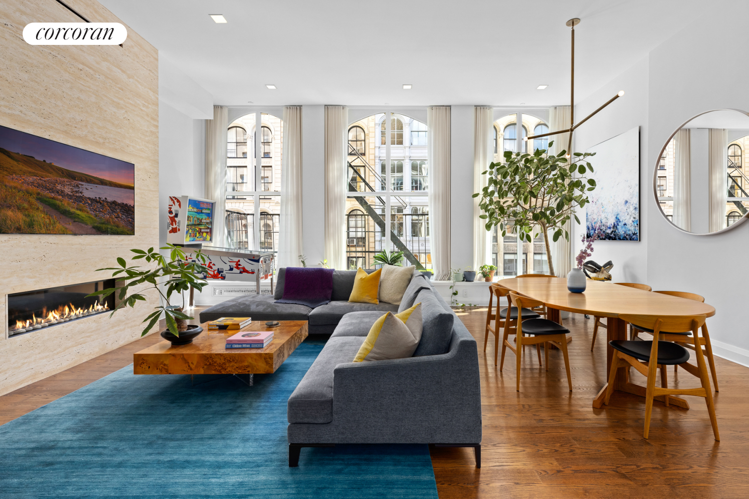 a living room with furniture and wooden floor