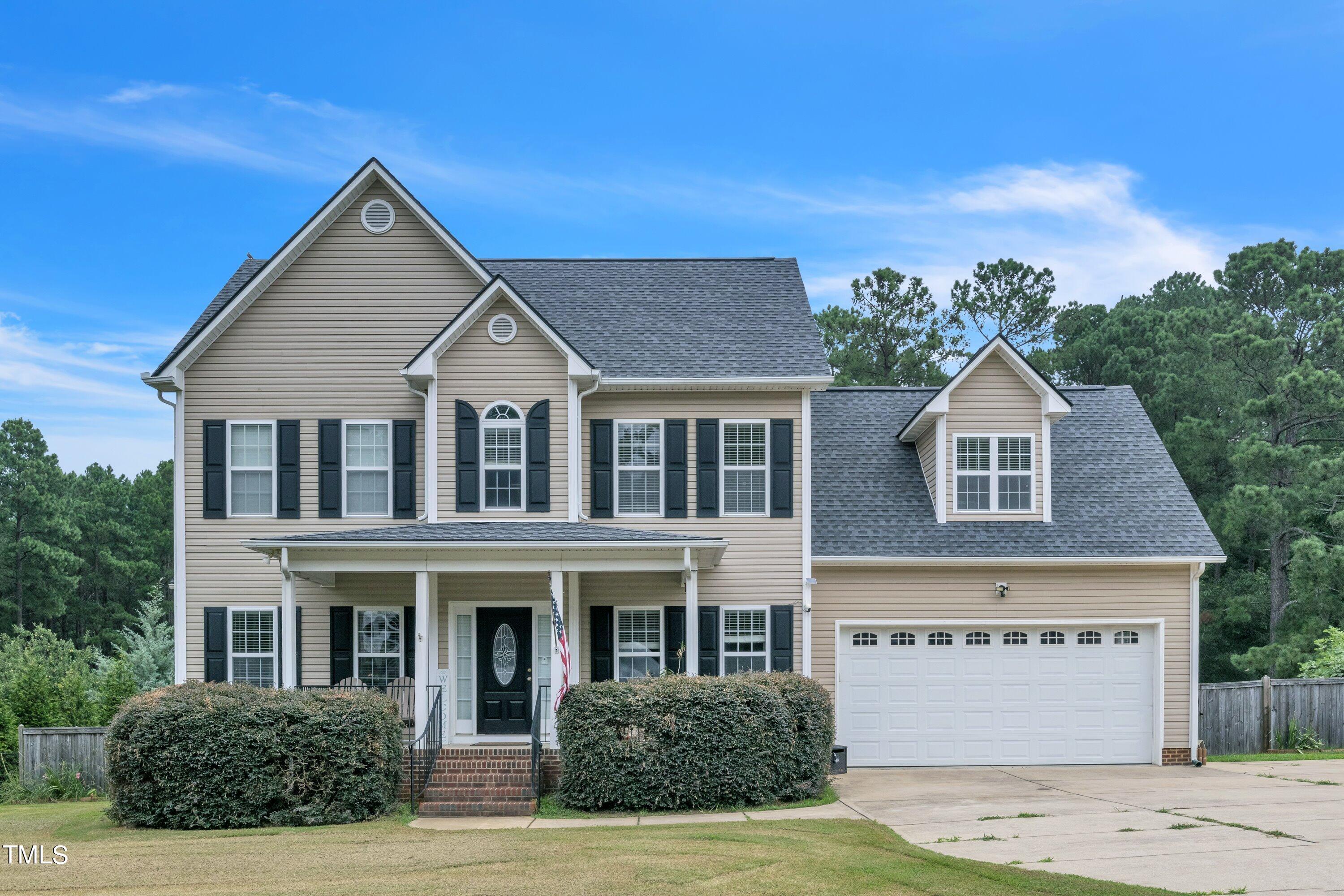 a view of house with yard