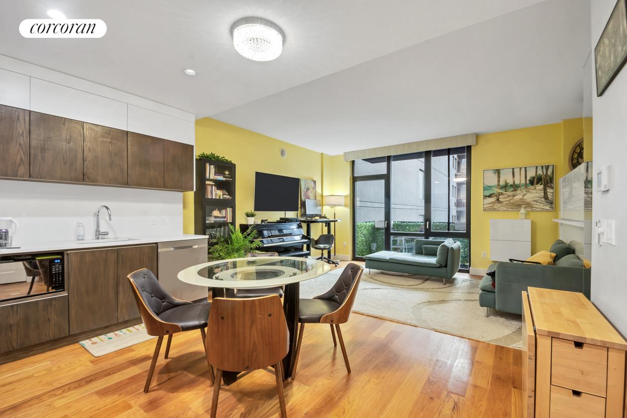 a view of a dining room with furniture window and outside view