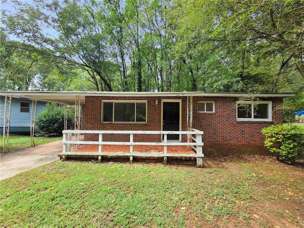 front view of a house with a yard