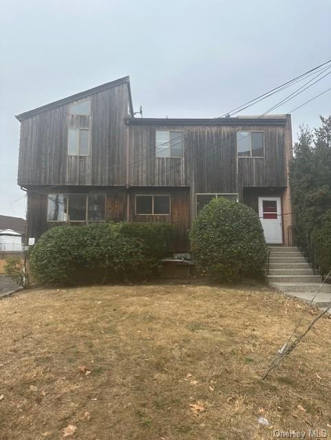 View of front of house with a front yard