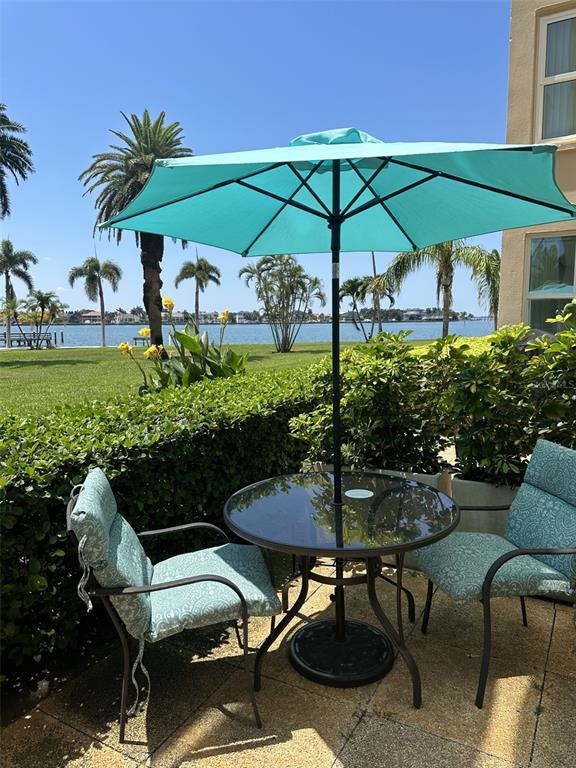 a view of a patio with furniture and a fire pit