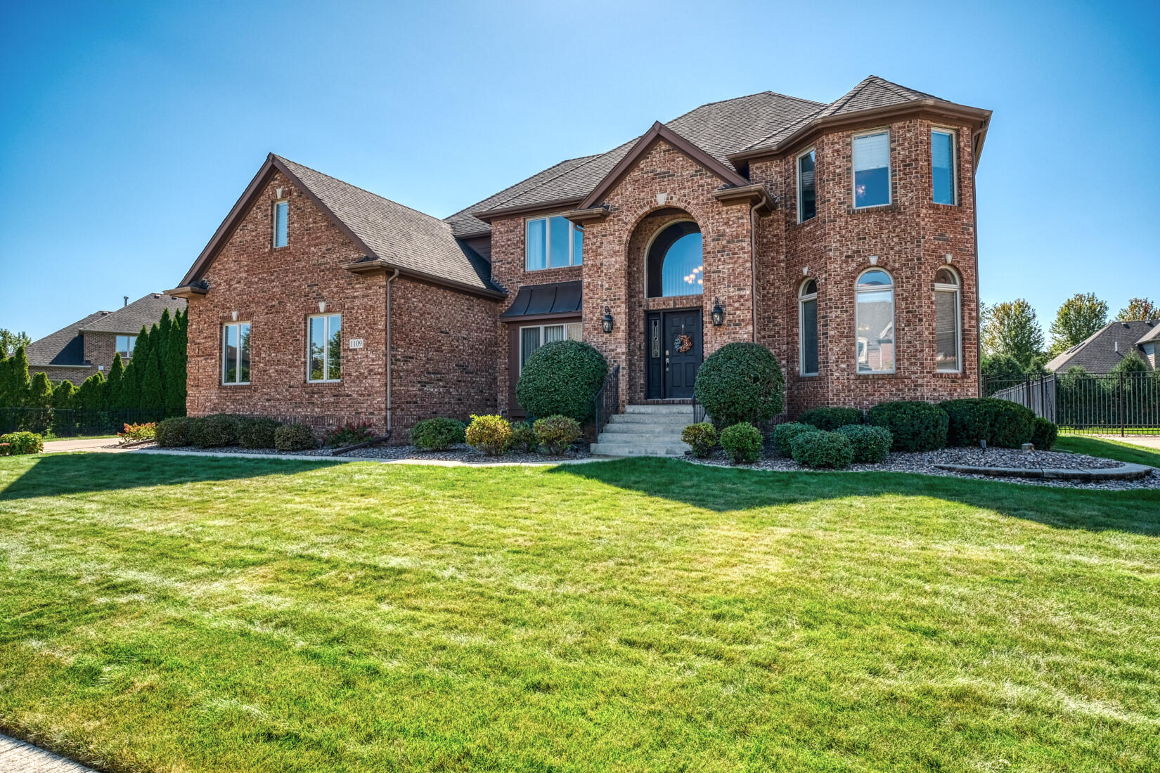 a front view of a house with garden