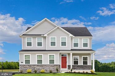 a front view of a house with yard