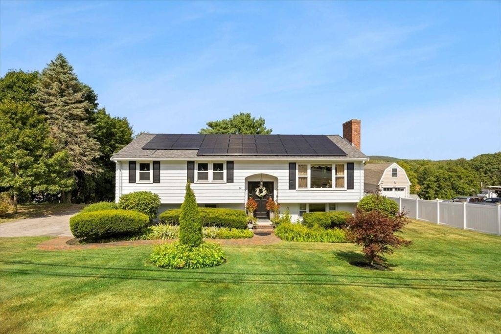 a front view of a house with garden