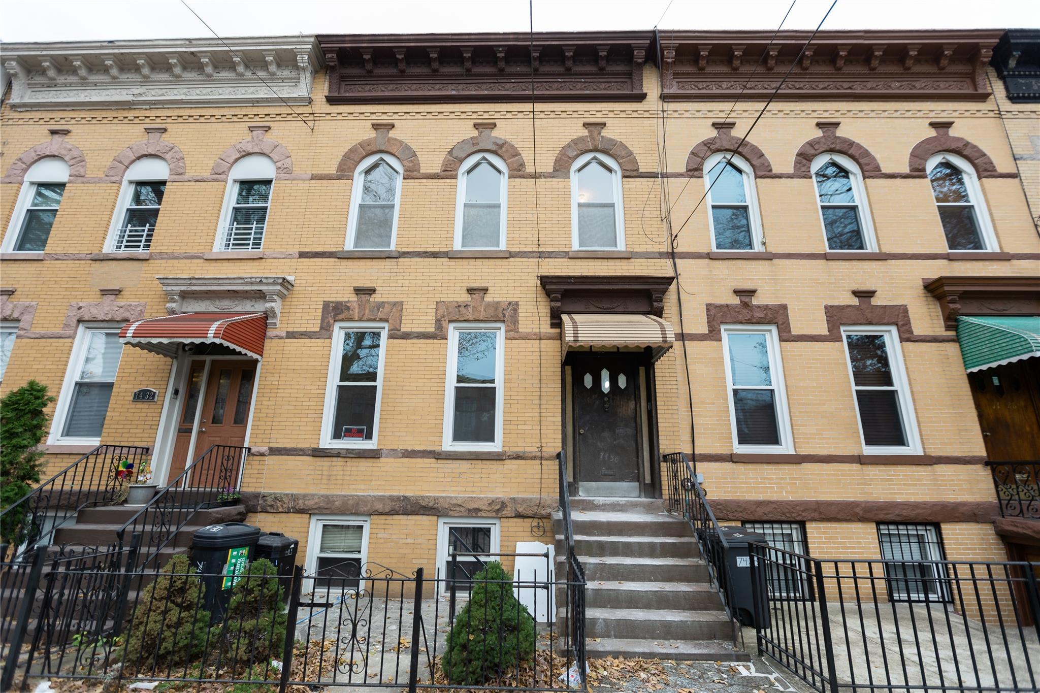 a front view of a building with a lots of windows