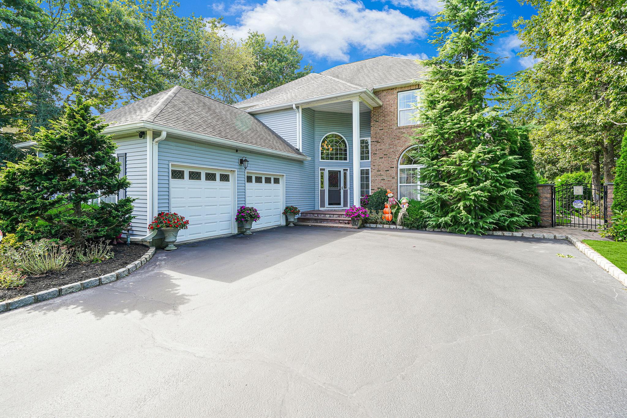 View of property featuring a garage