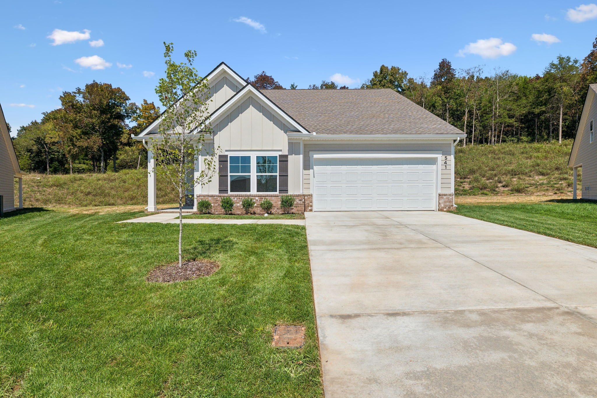 a front view of a house with garden