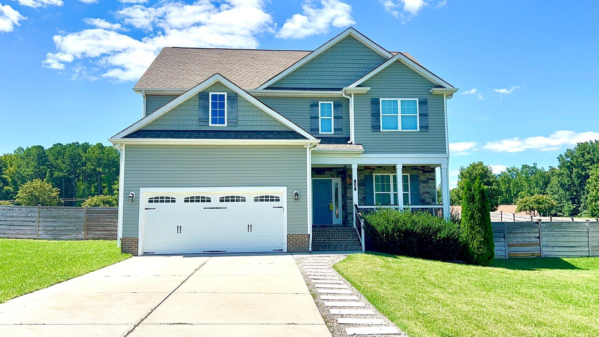 a front view of a house with yard