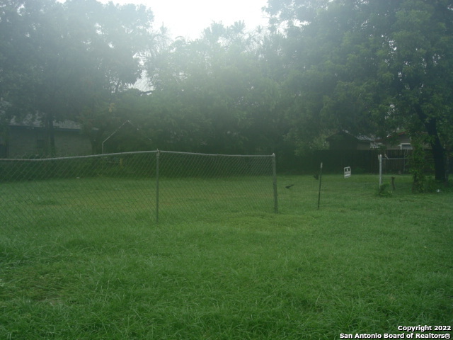 a view of a field and basketball court