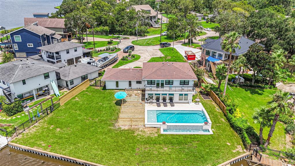 an aerial view of multiple houses with yard