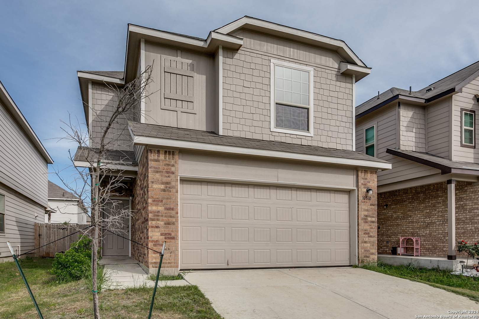 a front view of a house with a garage