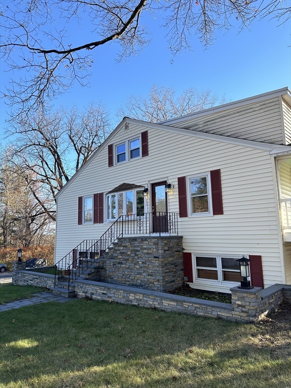 a front view of a house with a yard