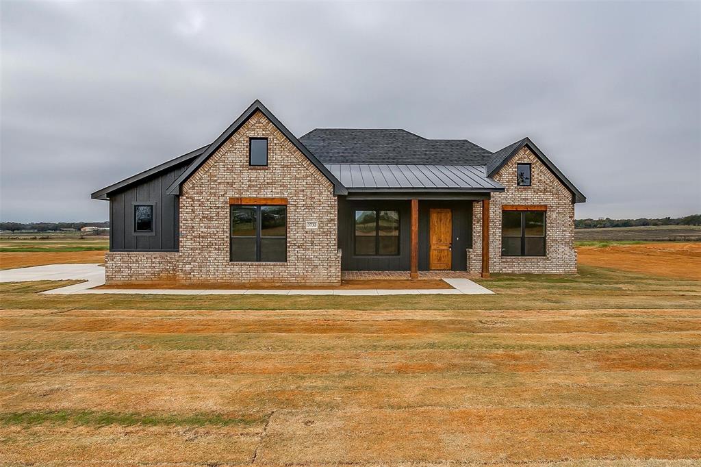 a front view of a house with a ocean view