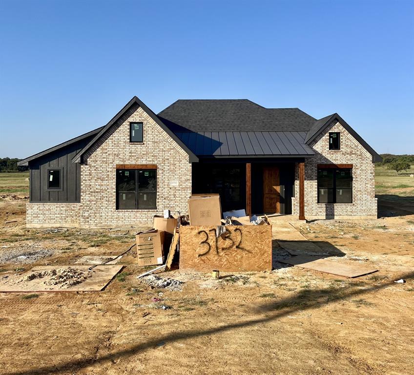 a front view of a house with a lounge chair