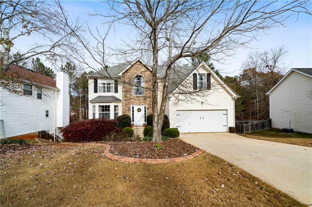 a front view of a house with a yard