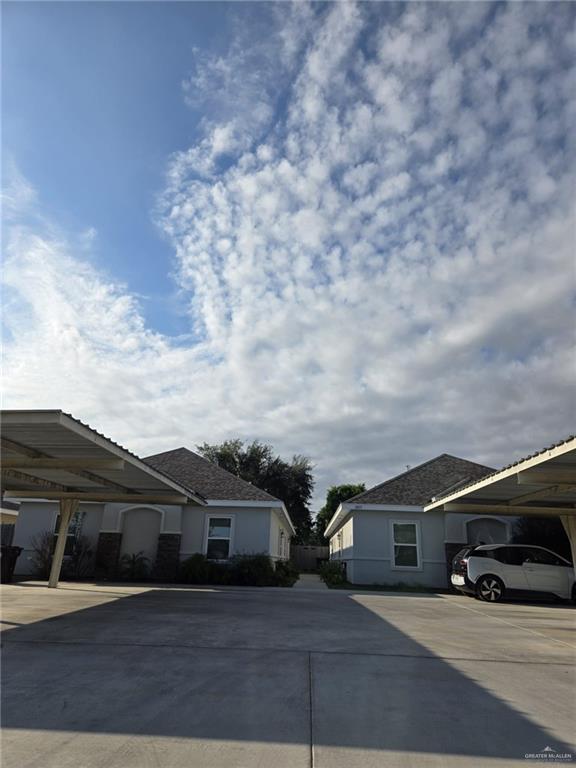 View of side of home featuring a carport