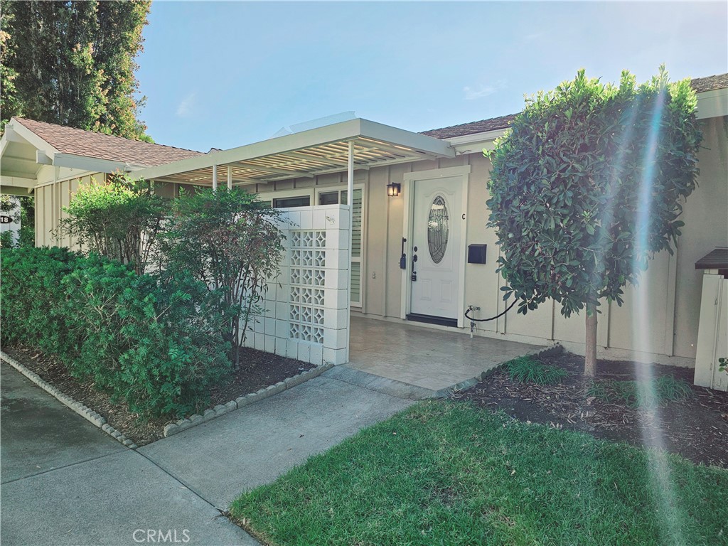 a view of a house with a yard and garage