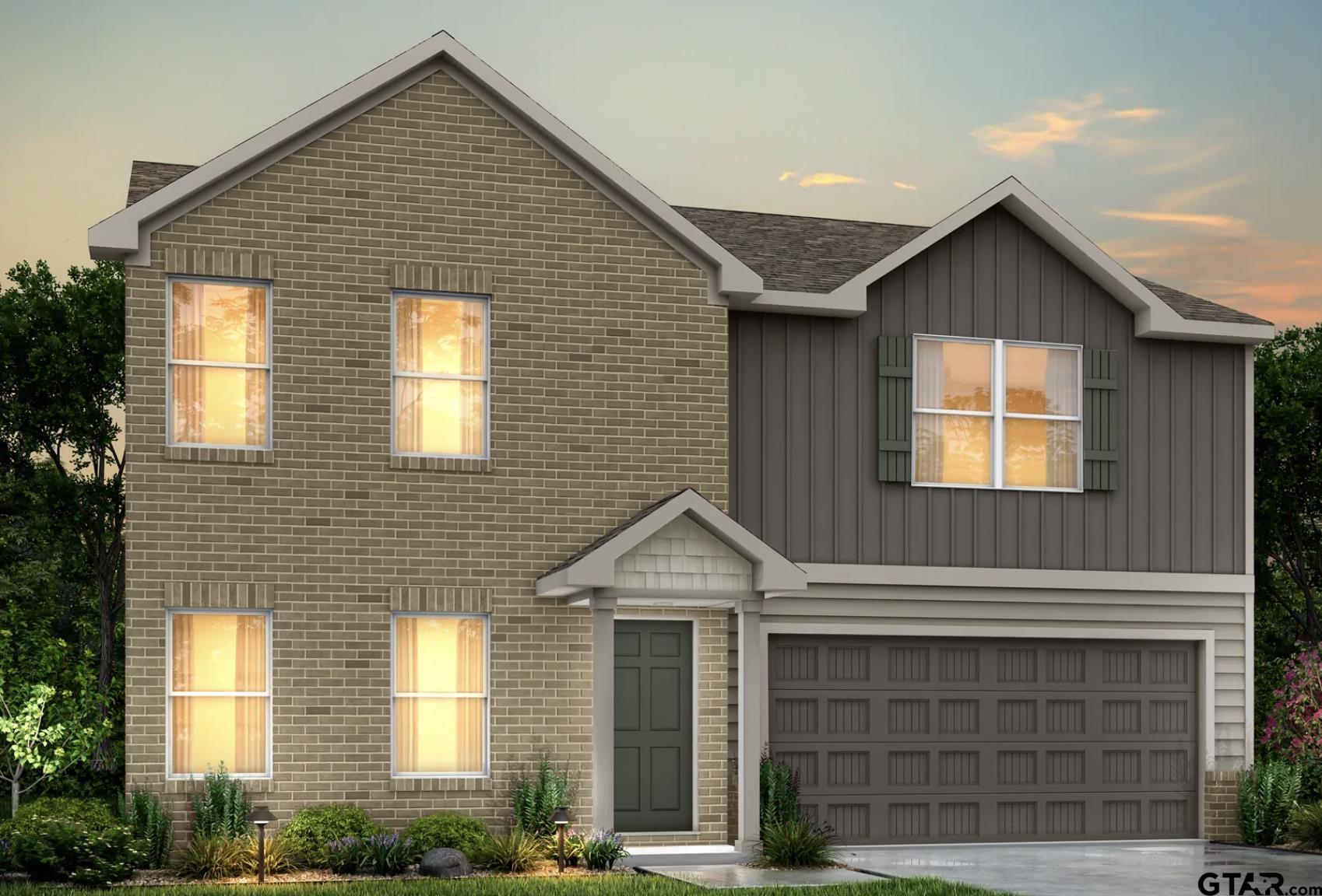 a front view of a house with garage