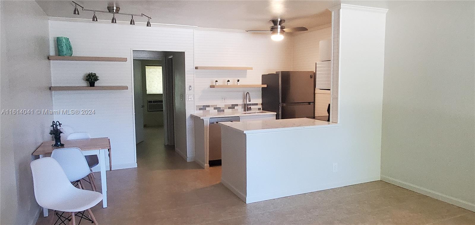 a bathroom with a sink vanity and mirror