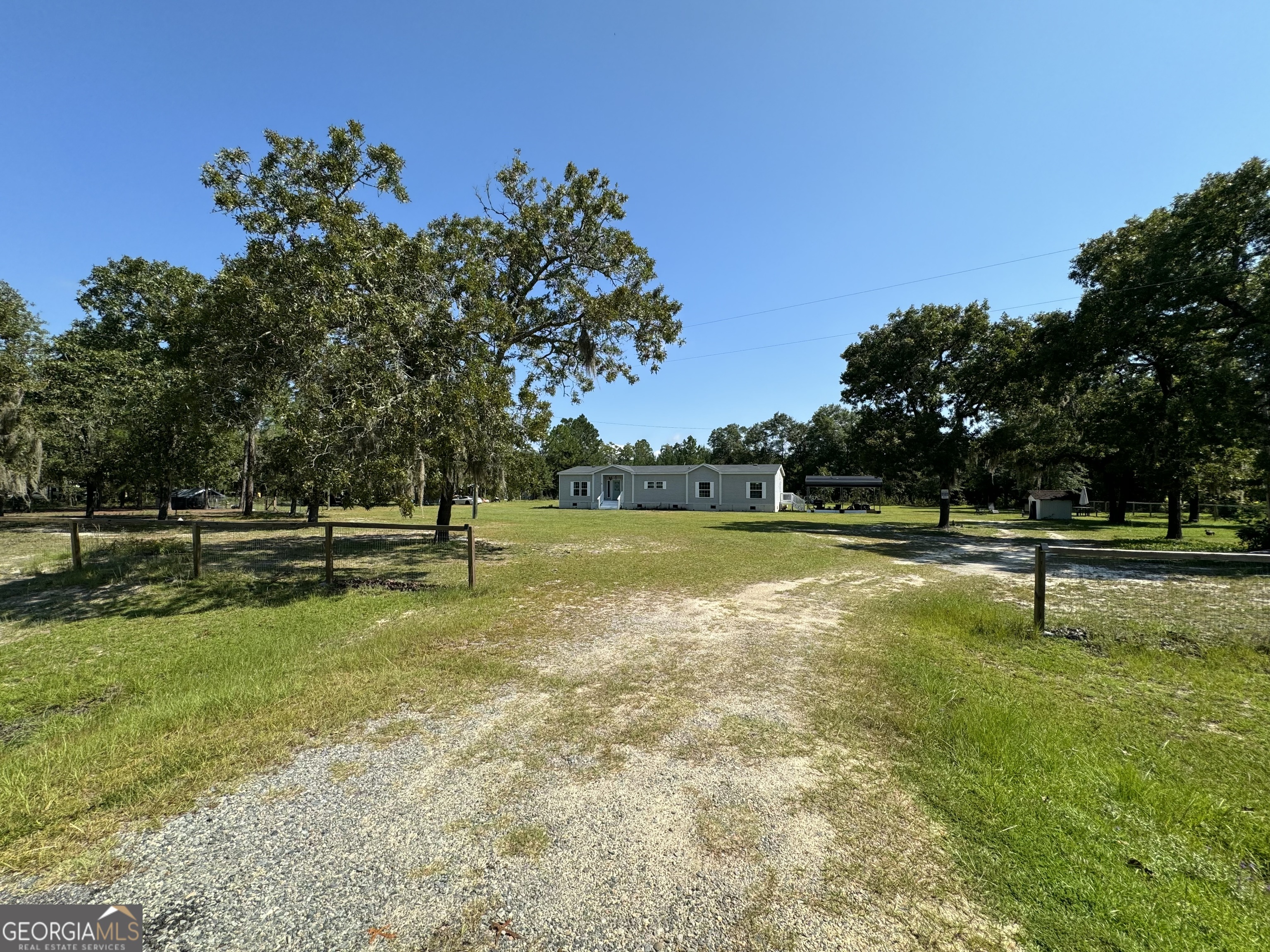 a view of a park with large trees