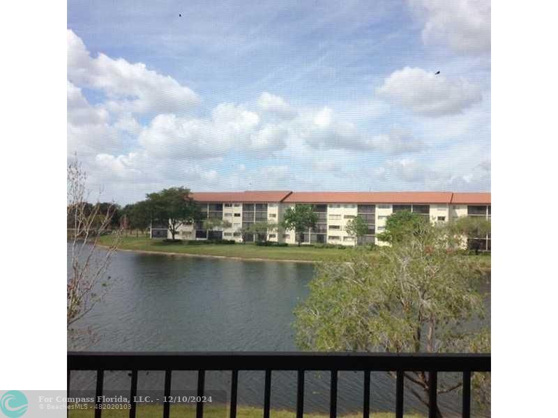 a view of a lake from a balcony