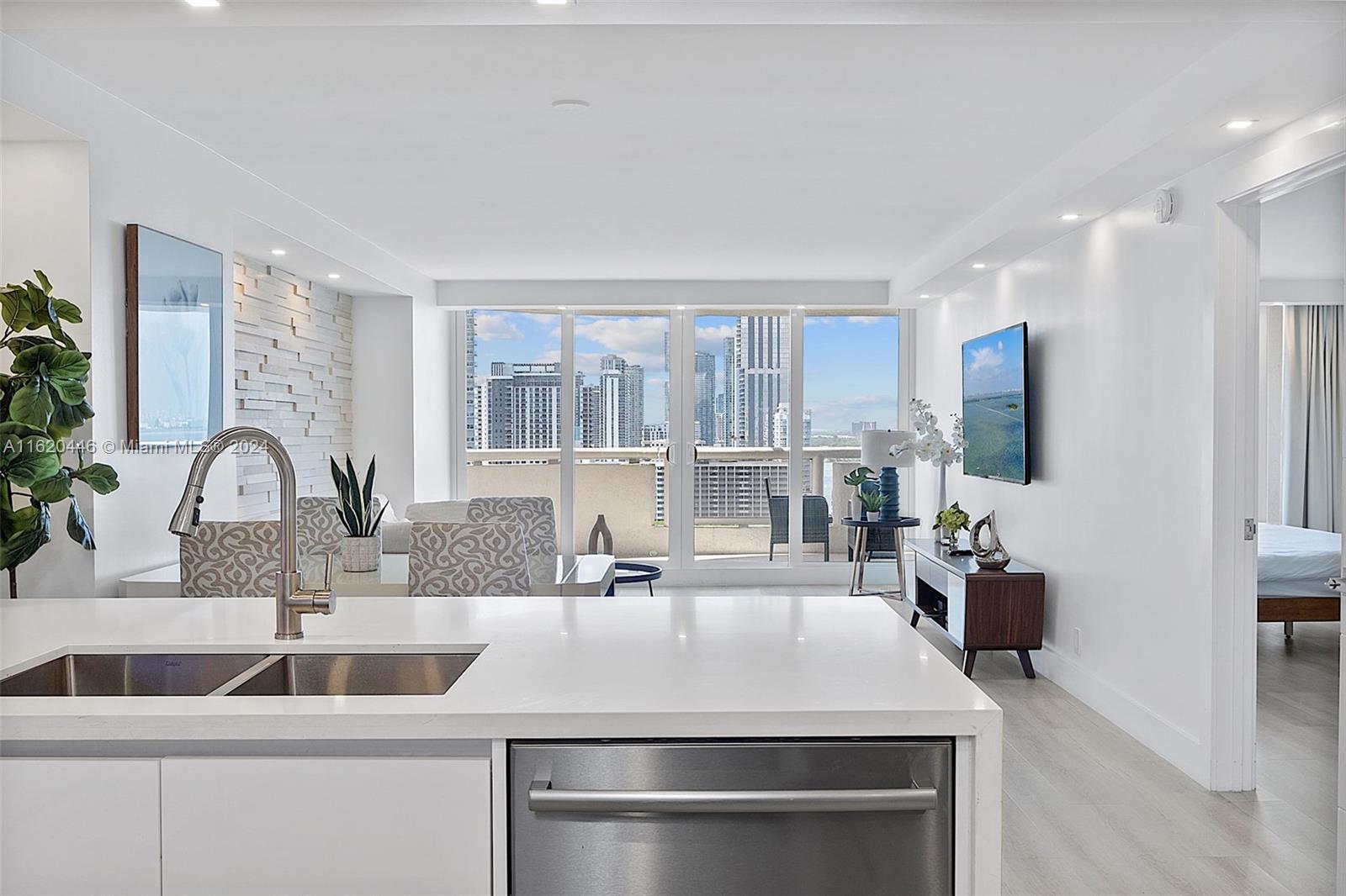 a kitchen with a sink and a refrigerator