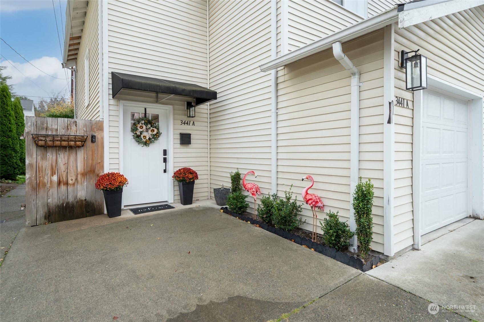 a view of a house with potted plants