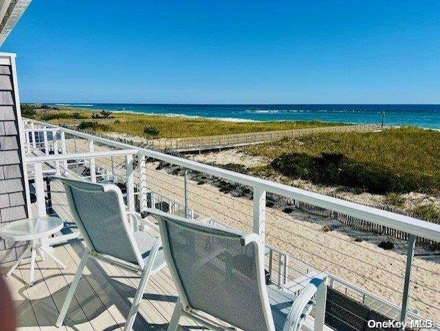 a view of a balcony with an ocean