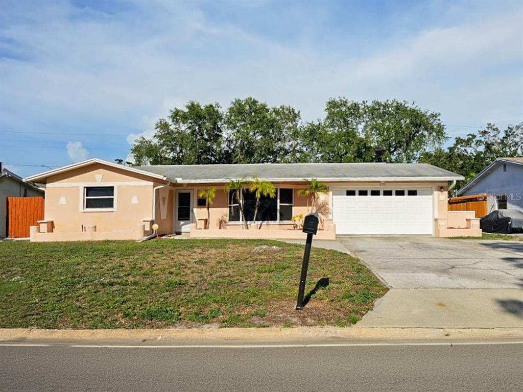 front view of a house with a yard