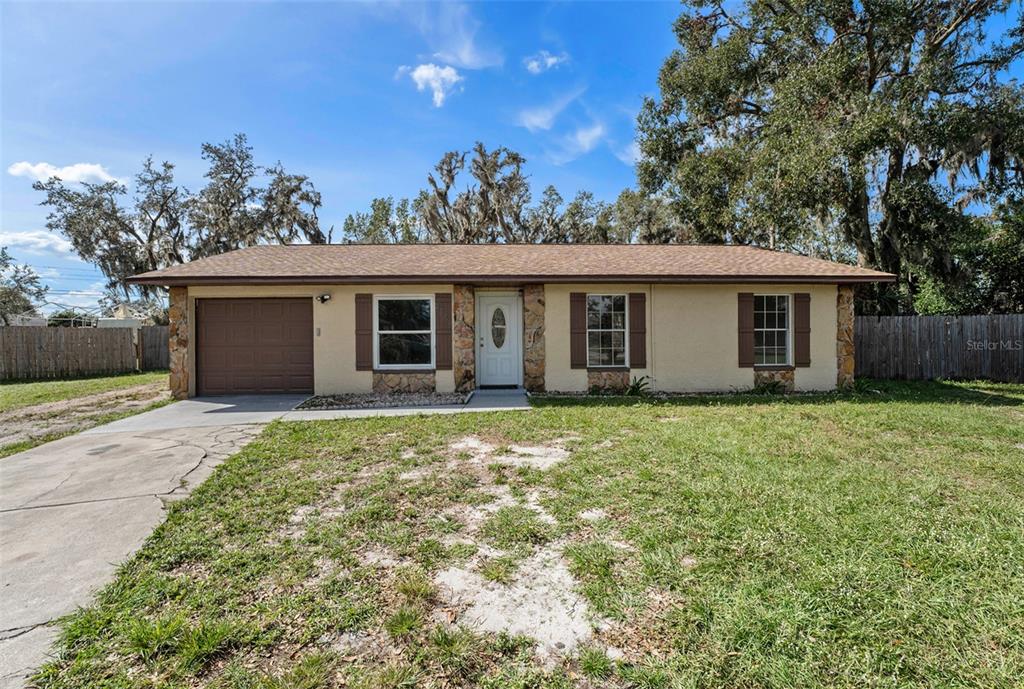 front view of a house with a yard