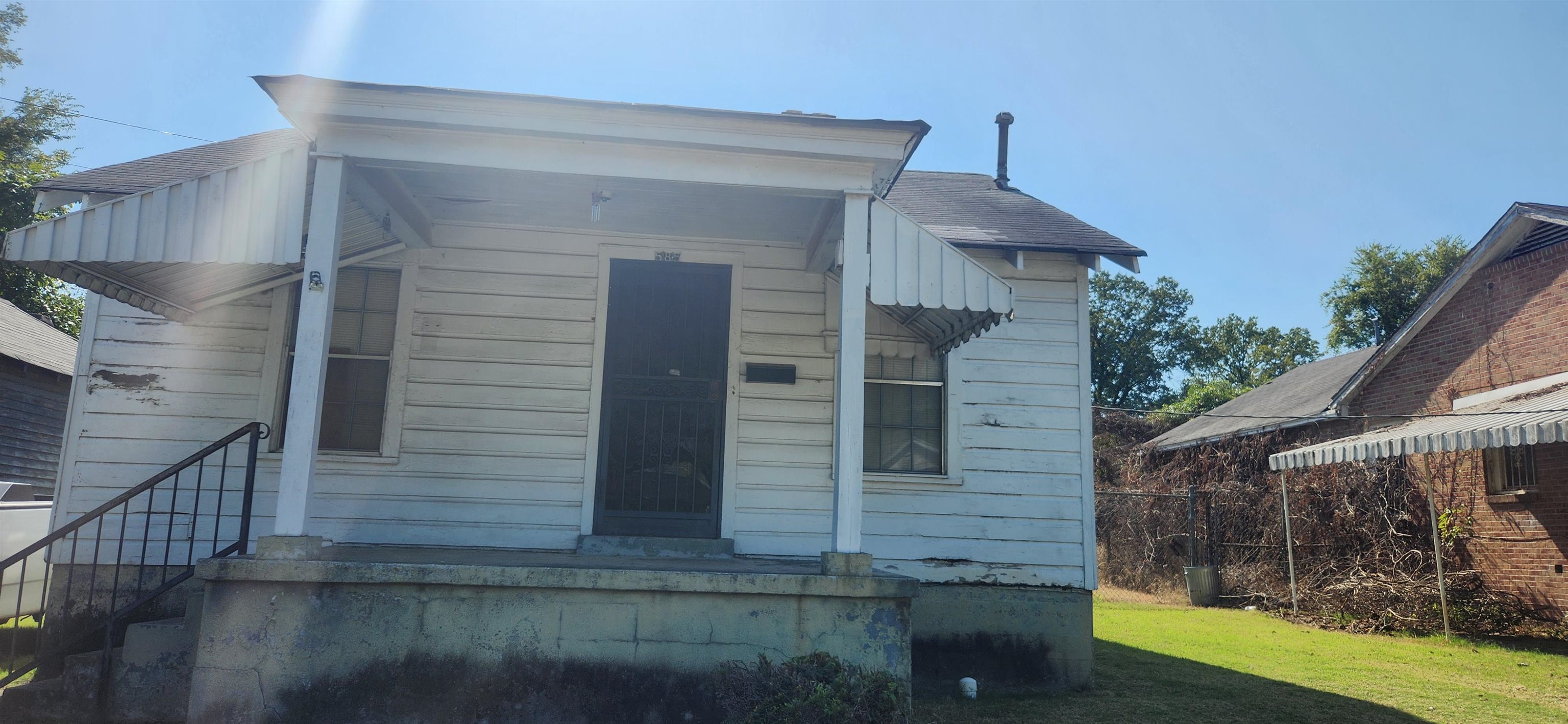 a view of house with wooden stairs