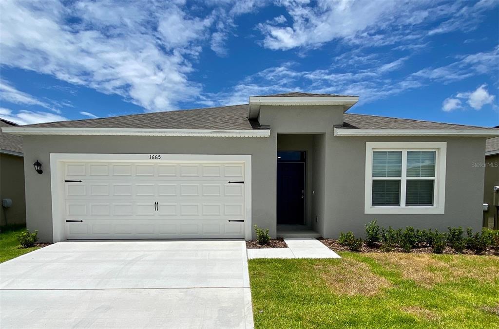 front view of a house with a yard