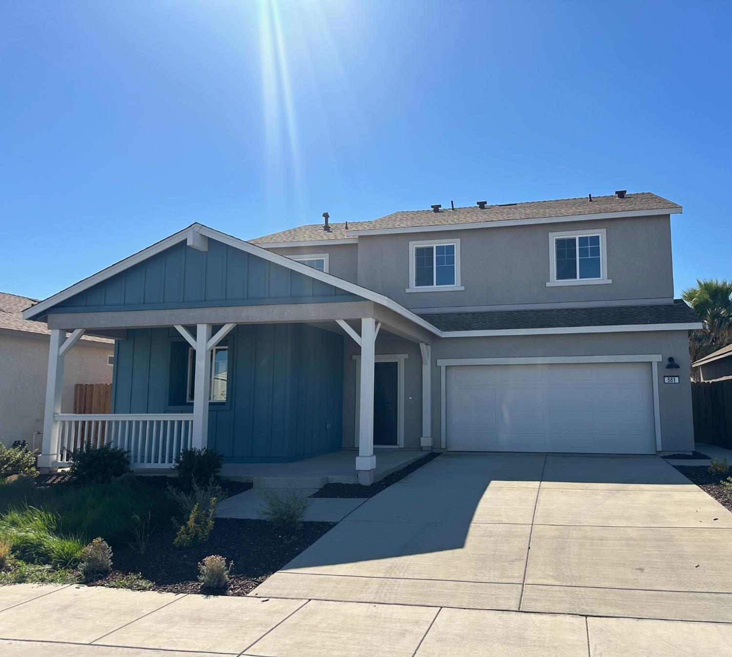 a front view of a house with yard