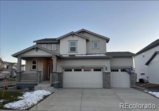 a front view of a house with garage