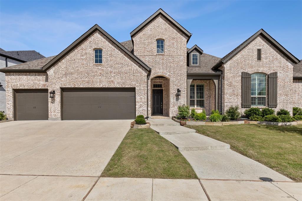 a front view of a house with yard