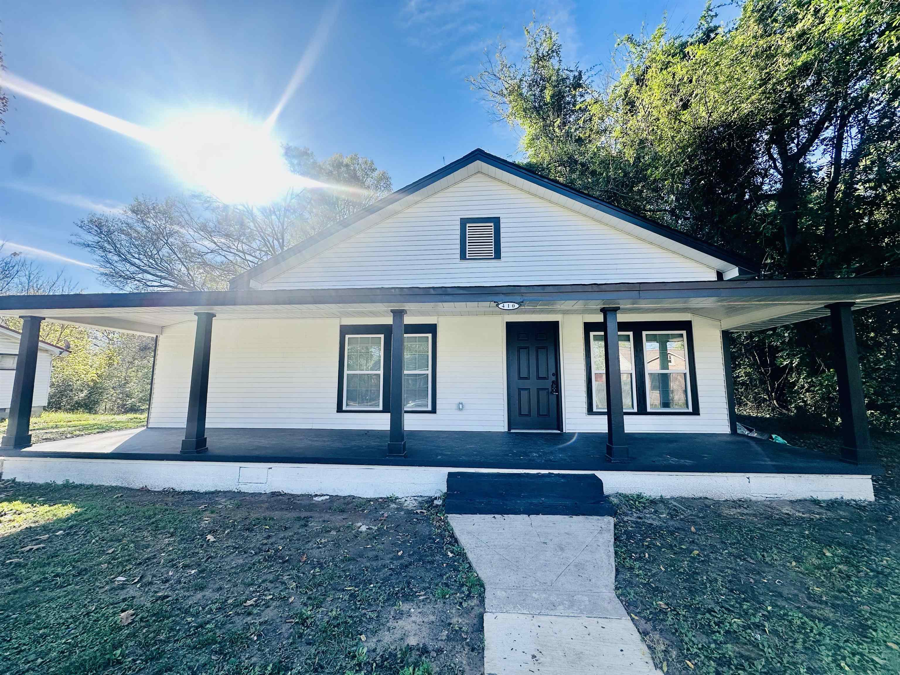 View of front of house with covered porch