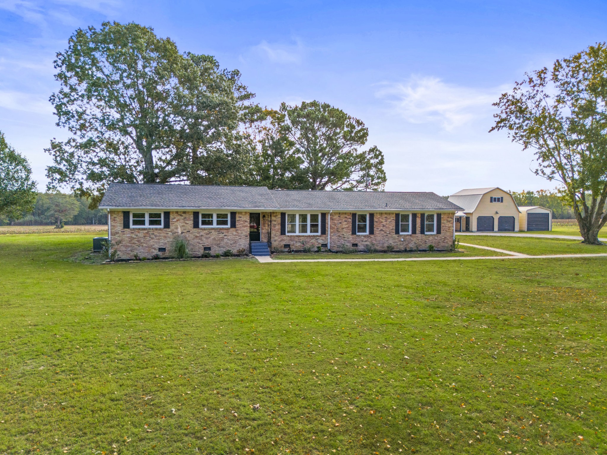 a front view of a house with swimming pool having outdoor seating