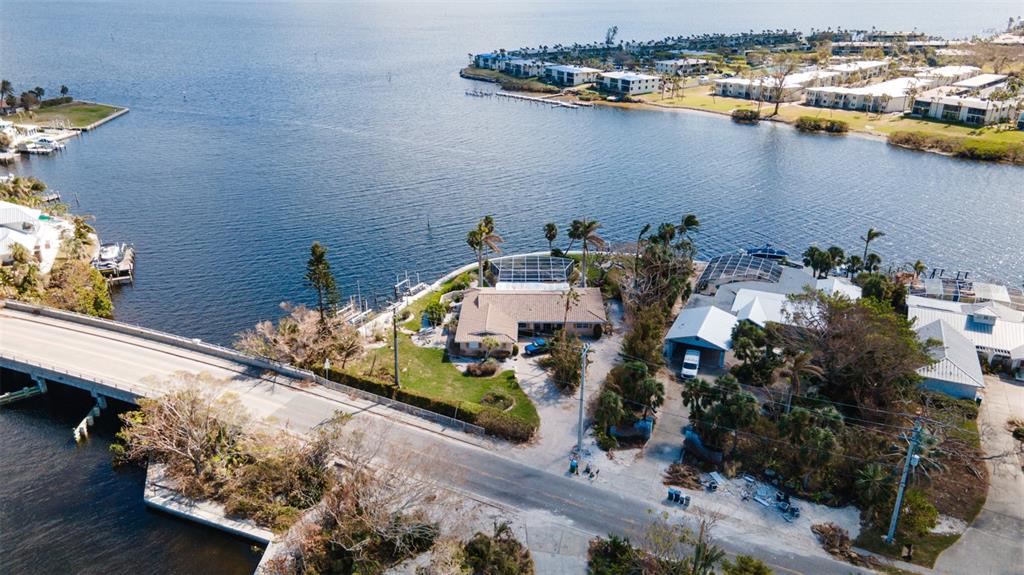 an aerial view of a house with a lake view