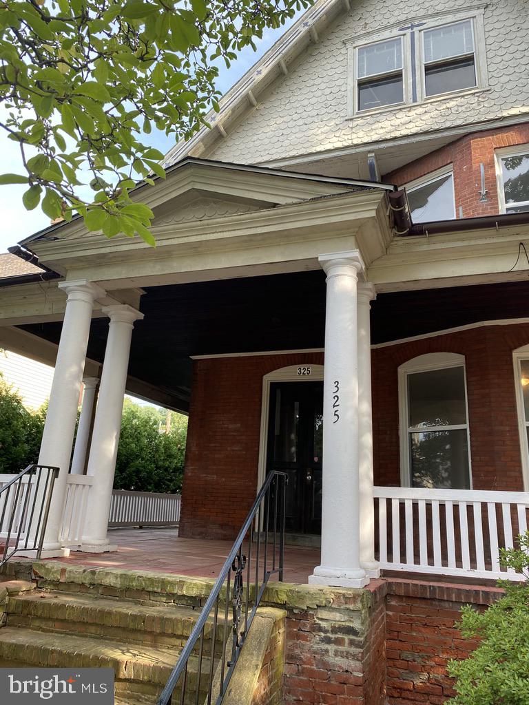 a view of front door and small yard