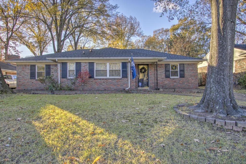 Single story home featuring a front yard