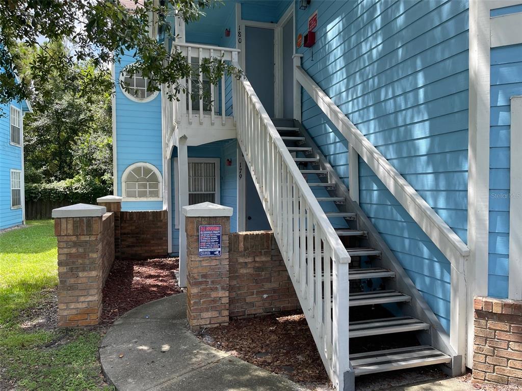 a front view of a house with wooden stairs