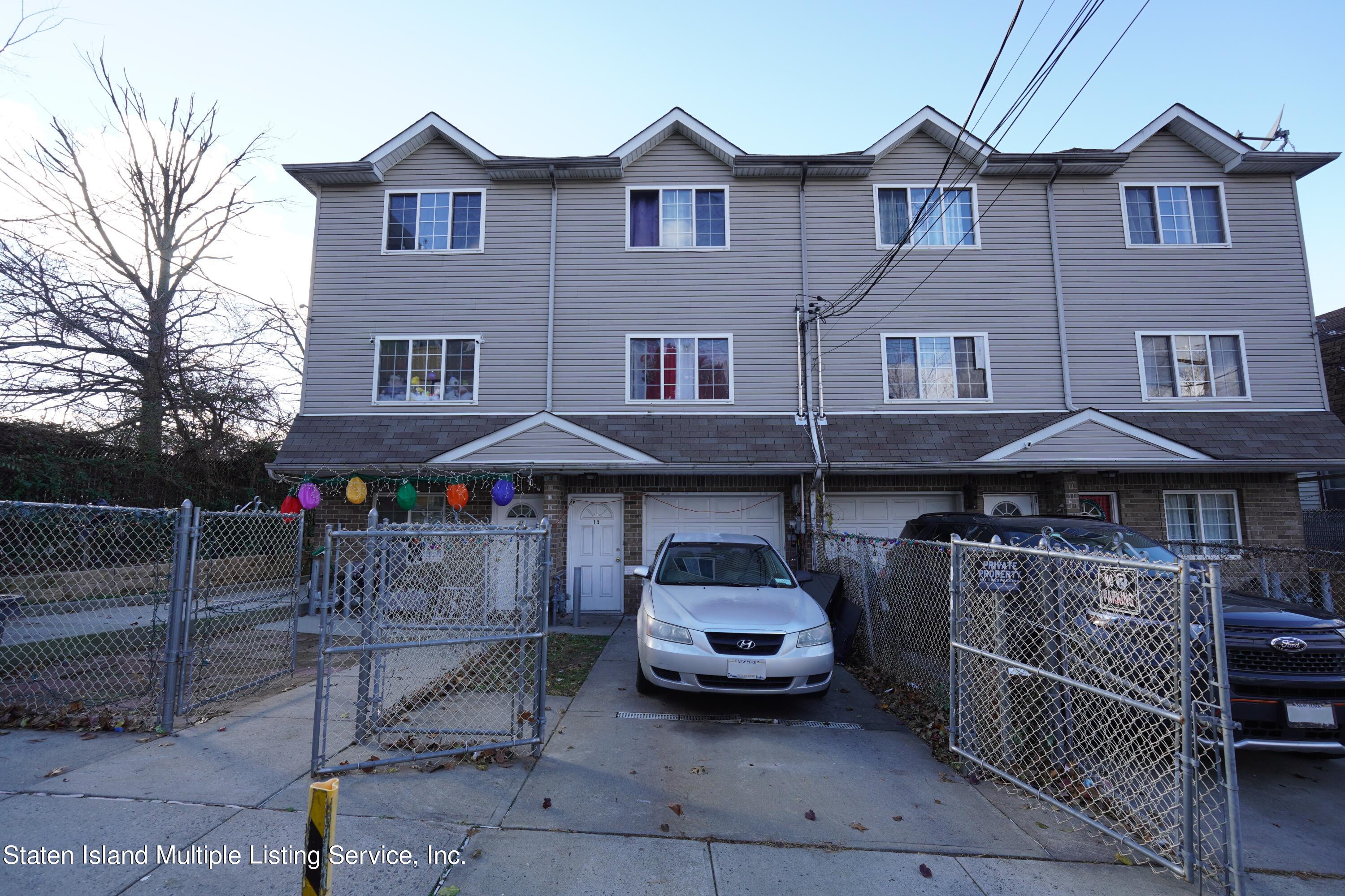 a front view of a house with parking space