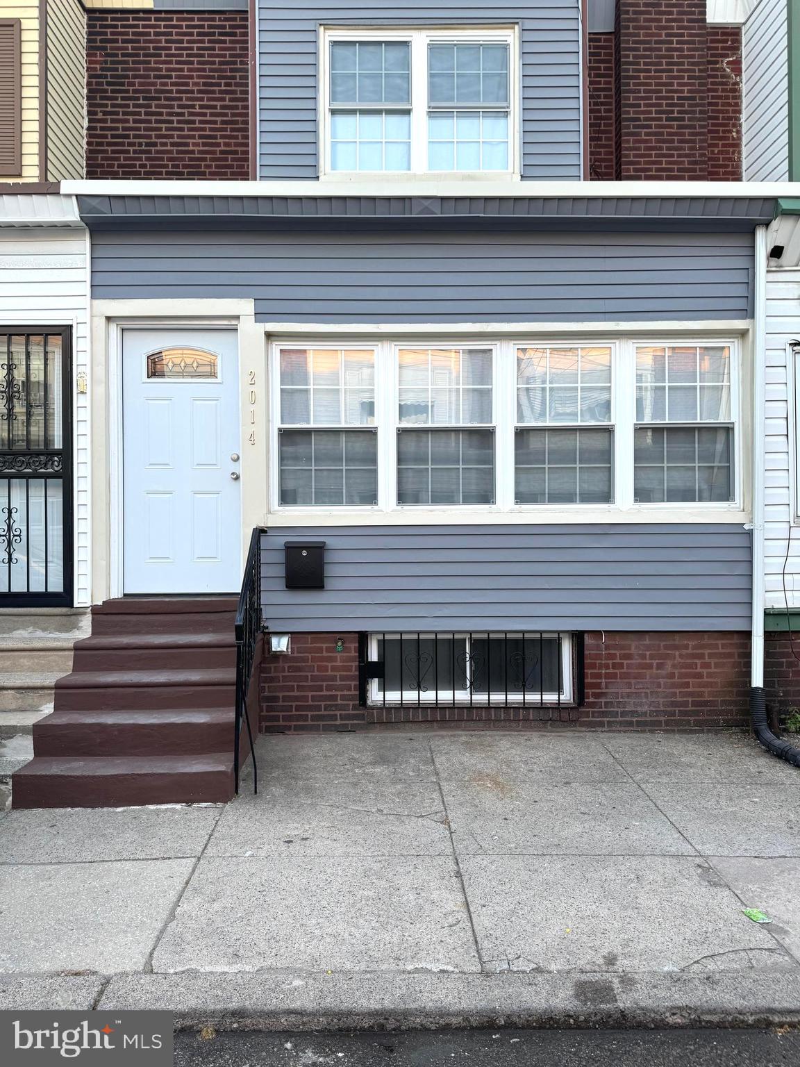 a view of a house with a bench