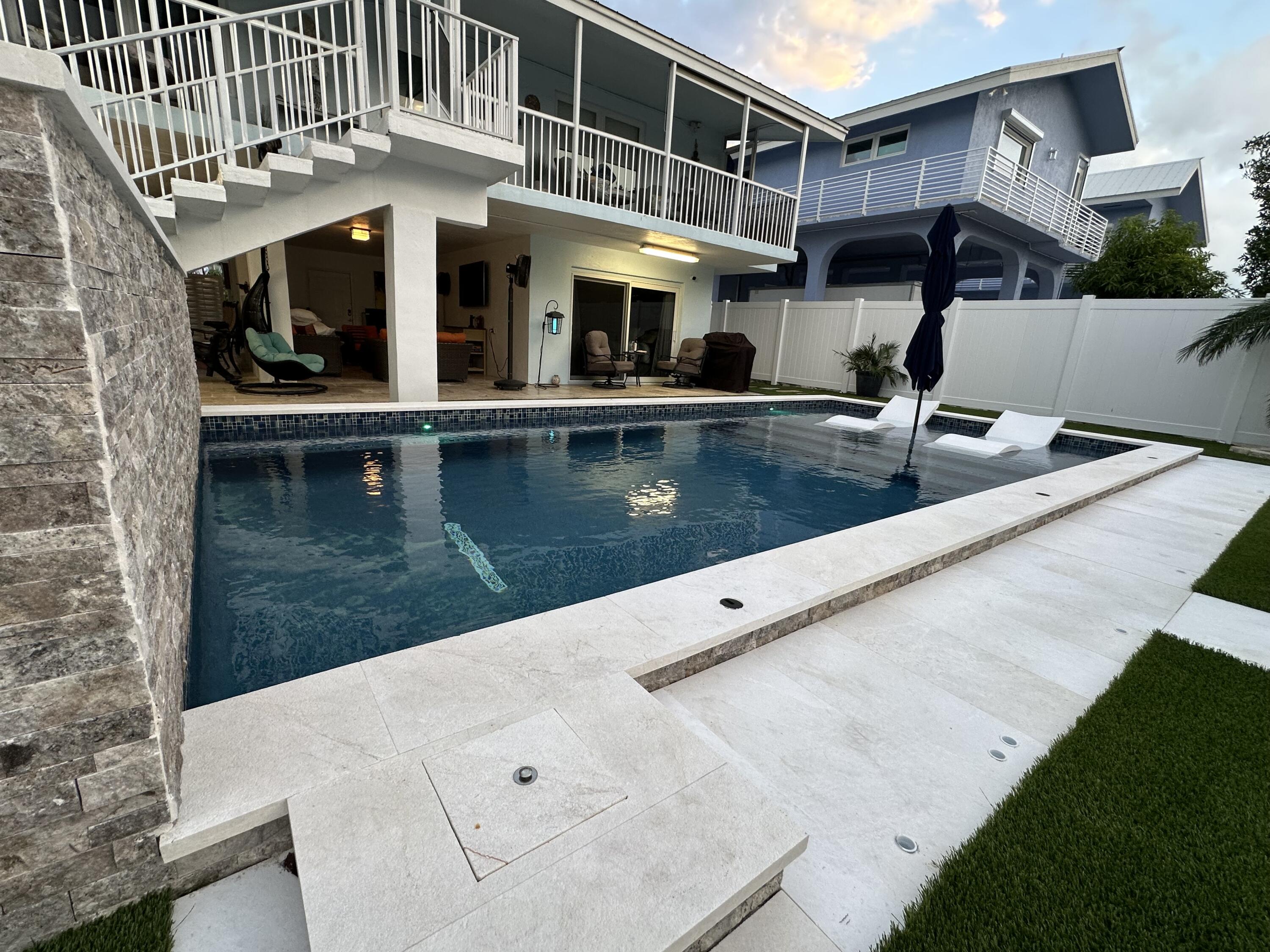 a view of a house with swimming pool